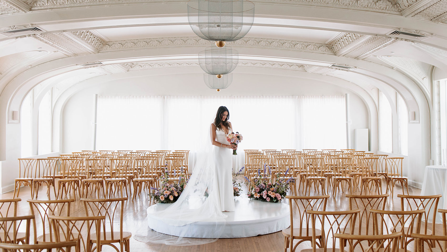 Bride in center of room on altar