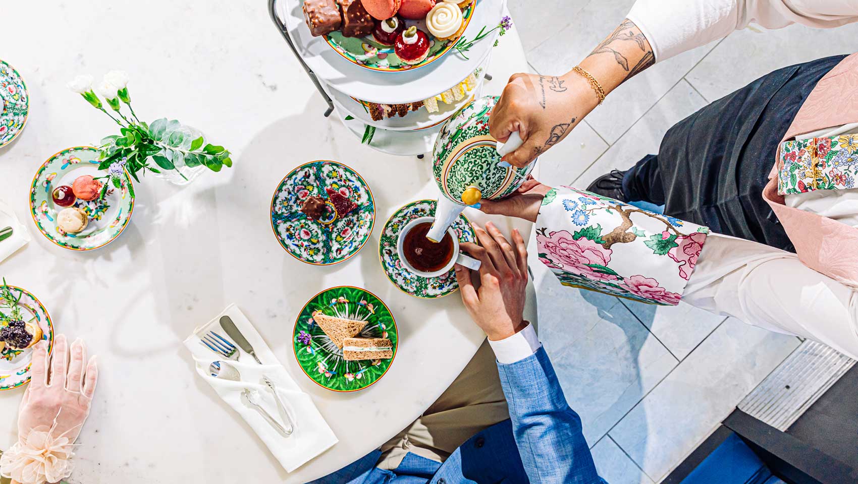hands pouring tea at Kimpton Cottonwood Hotel