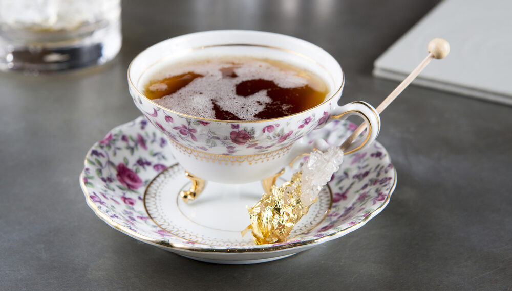 A cup of tea + rock candy with gold leaf