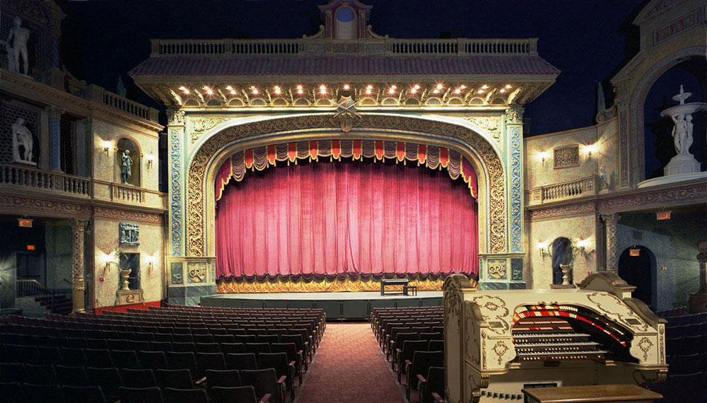 a performing arts theater with seats and a stage