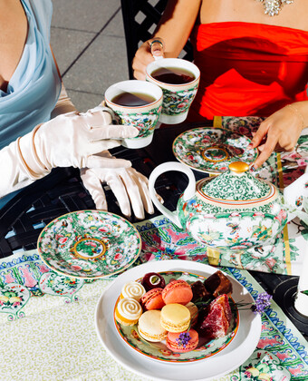 Guests at Fontenelle Tea Room doing a tea cheers