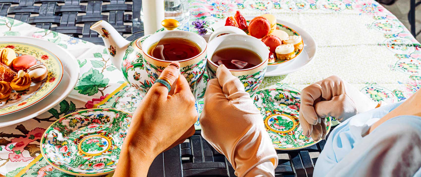 hands doing a tea cheers at Kimpton Cottonwood Hotel